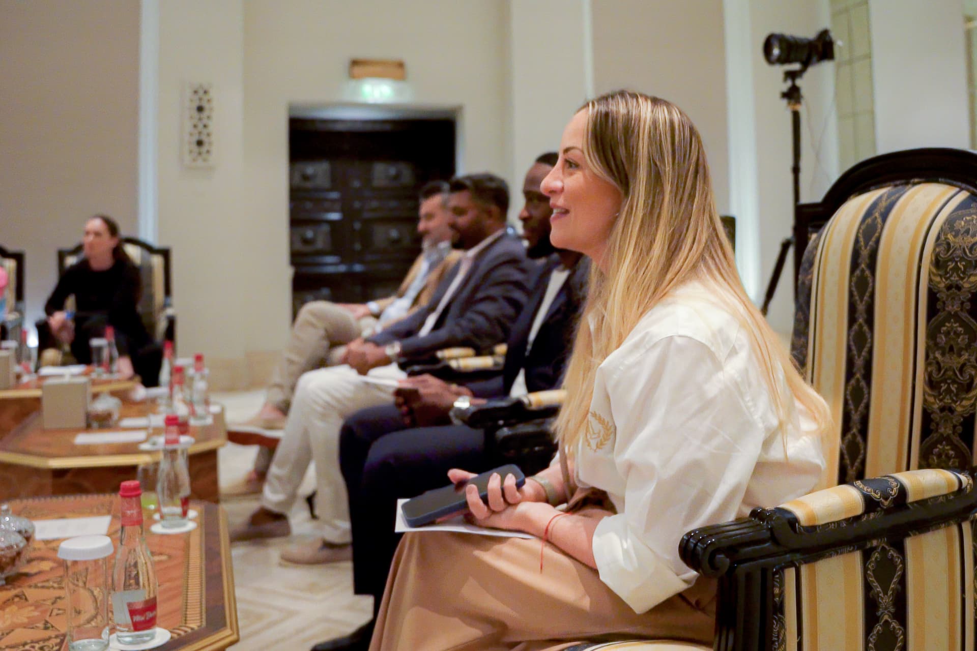 A speaker sharing Emirati stories with guests at a SIMA storytelling session